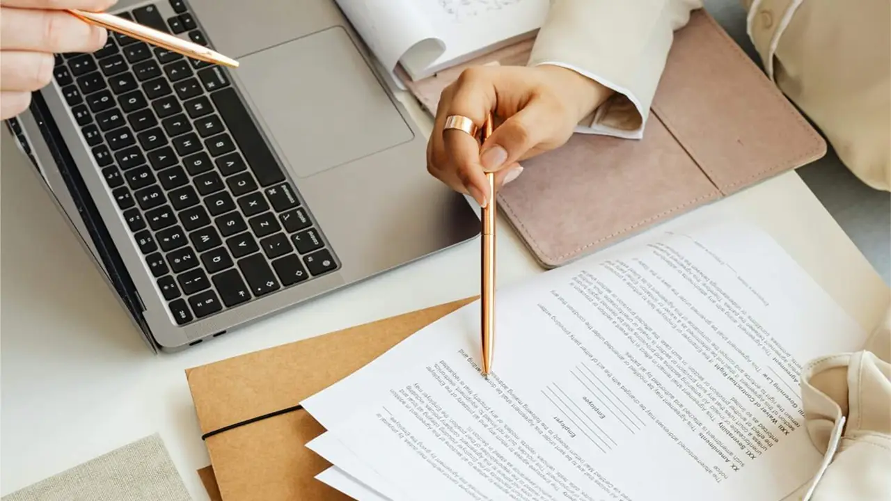 Close up of someone assessing documents